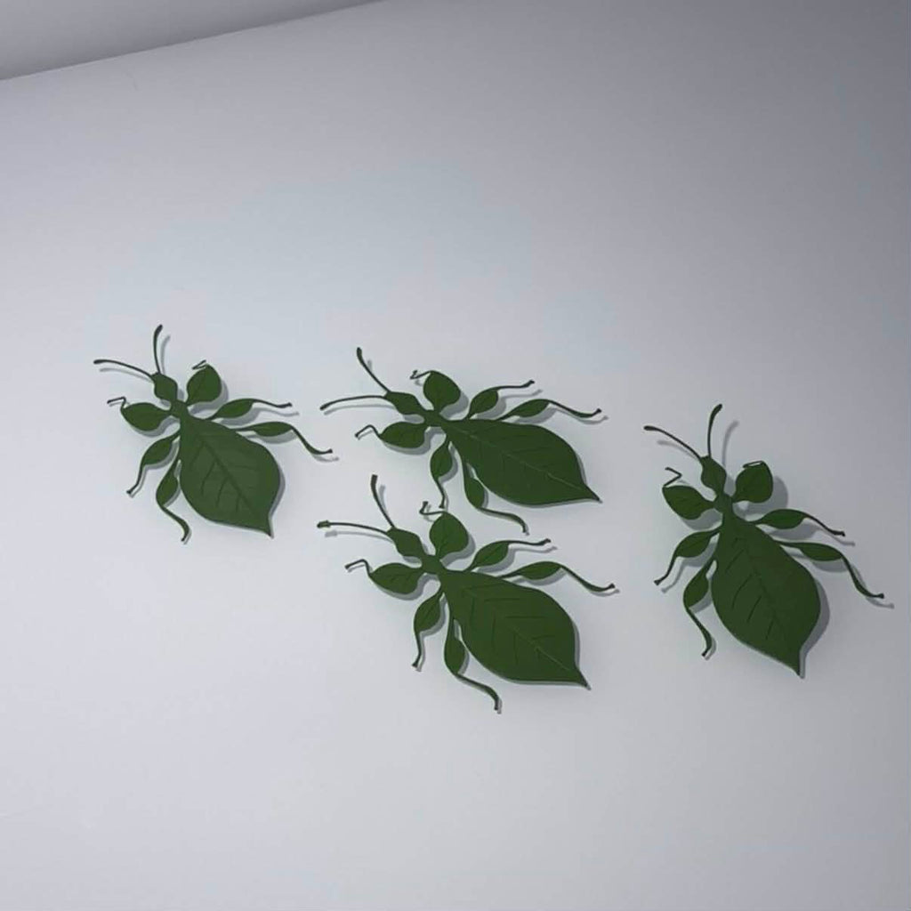 four bookmark green leaf bugs
