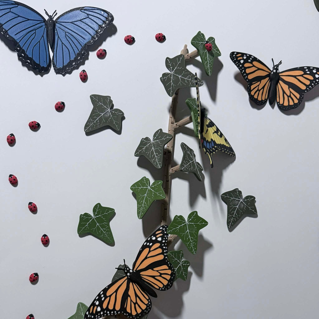 blue morpho, orange monarch, red ladybug, and green leave magnets